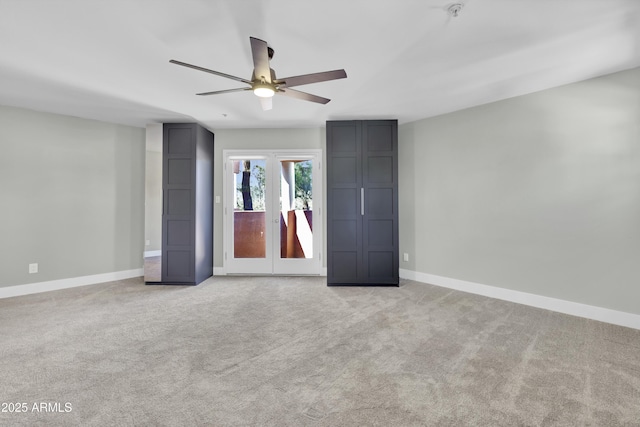 unfurnished bedroom featuring ceiling fan and light carpet