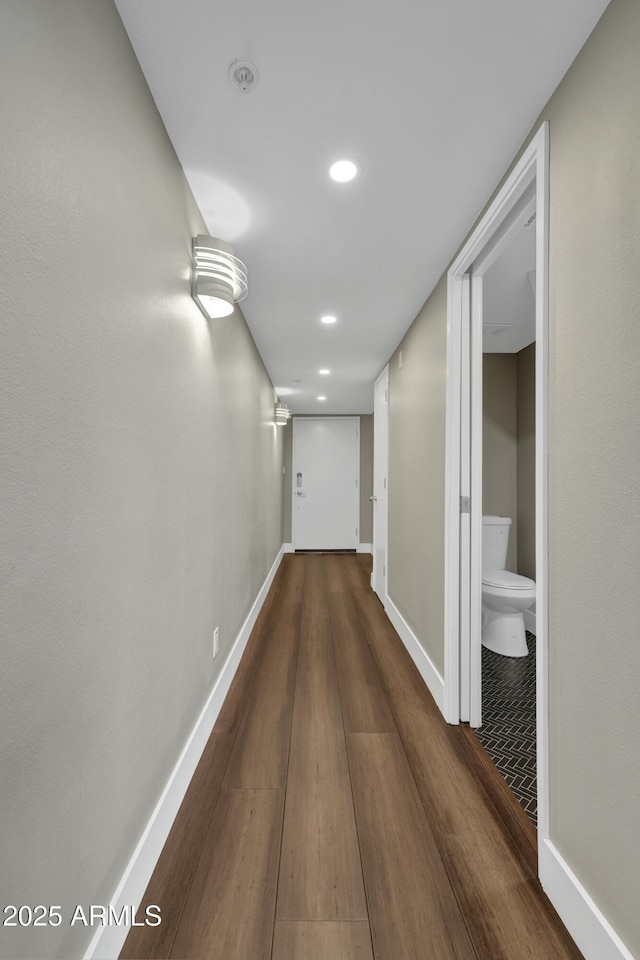 hallway featuring dark hardwood / wood-style flooring