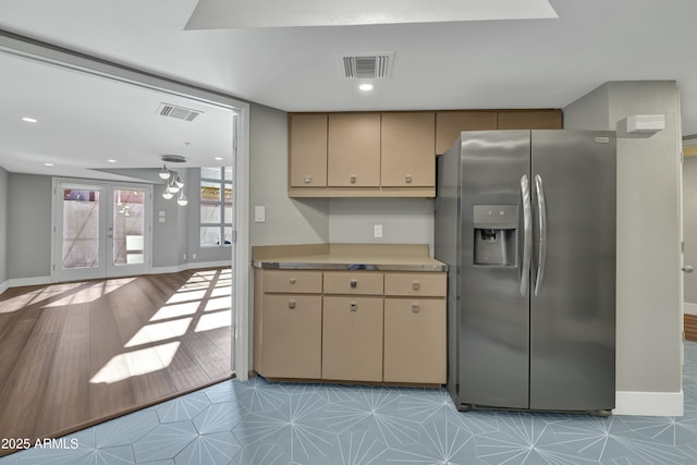 kitchen featuring stainless steel fridge and french doors