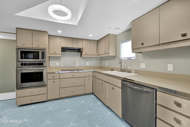 kitchen featuring light tile patterned floors, appliances with stainless steel finishes, and sink