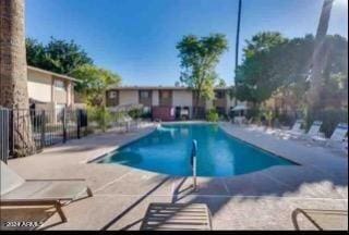 view of swimming pool with a patio