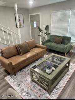 living room featuring dark hardwood / wood-style flooring