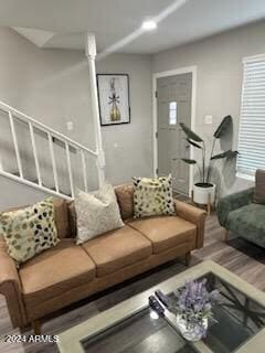 living room with a healthy amount of sunlight and hardwood / wood-style floors