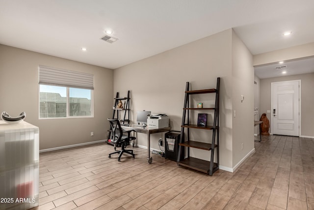 office with light wood finished floors, baseboards, visible vents, and recessed lighting