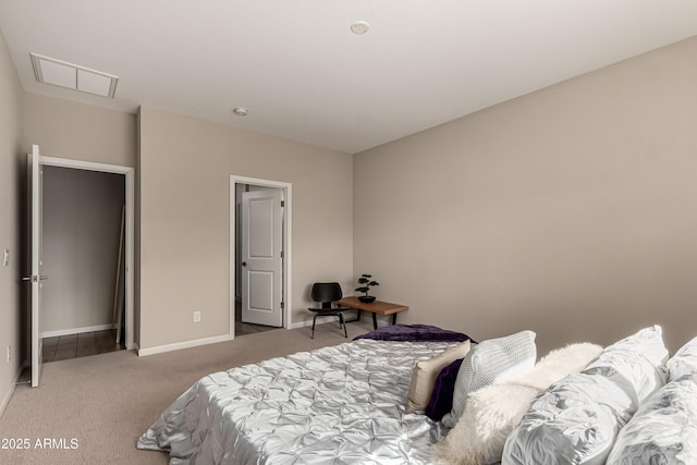 carpeted bedroom featuring visible vents and baseboards