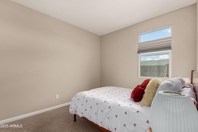 carpeted bedroom featuring baseboards