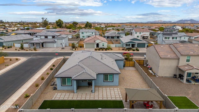 drone / aerial view with a residential view and a mountain view