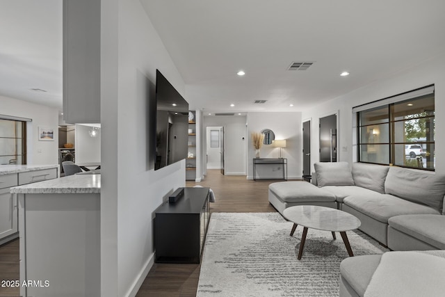 living room featuring dark hardwood / wood-style flooring