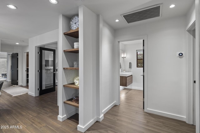 corridor featuring dark hardwood / wood-style floors