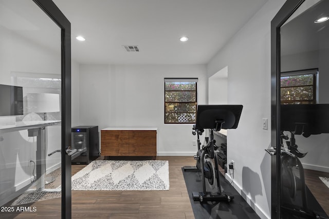 workout room with dark hardwood / wood-style flooring