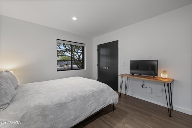 bedroom featuring dark hardwood / wood-style flooring