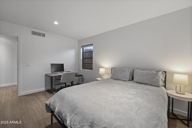 bedroom with wood-type flooring