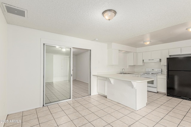 1512 W Crescent Ave, Mesa, AZ 85202 - kitchen featuring freestanding refrigerator, electric range, under cabinet range hood, a peninsula, and light countertops
