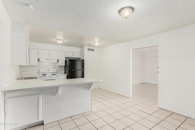 1512 W Crescent Ave, Mesa, AZ 85202 - kitchen with freestanding refrigerator, white range with electric cooktop, under cabinet range hood, a sink, and light countertops