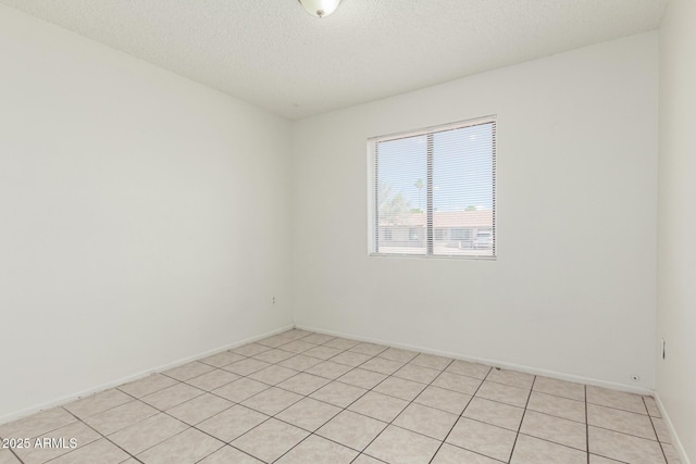 1512 W Crescent Ave, Mesa, AZ 85202 - empty room featuring a textured ceiling and baseboards