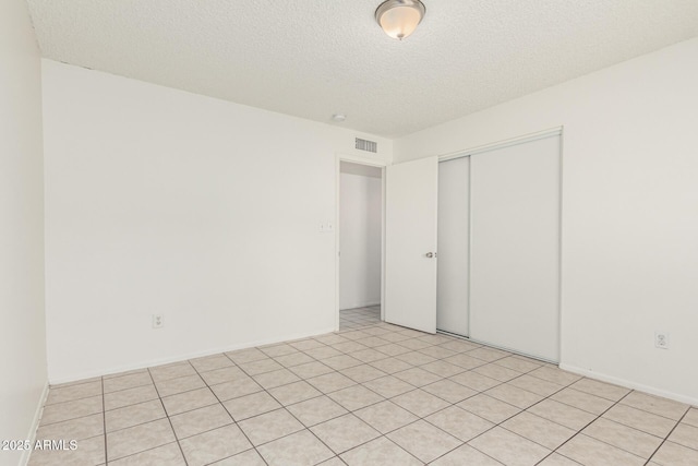 1512 W Crescent Ave, Mesa, AZ 85202 - unfurnished bedroom with a closet and a textured ceiling