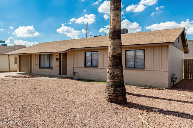 1512 W Crescent Ave, Mesa, AZ 85202 - ranch-style house with board and batten siding, an attached garage, and roof with shingles