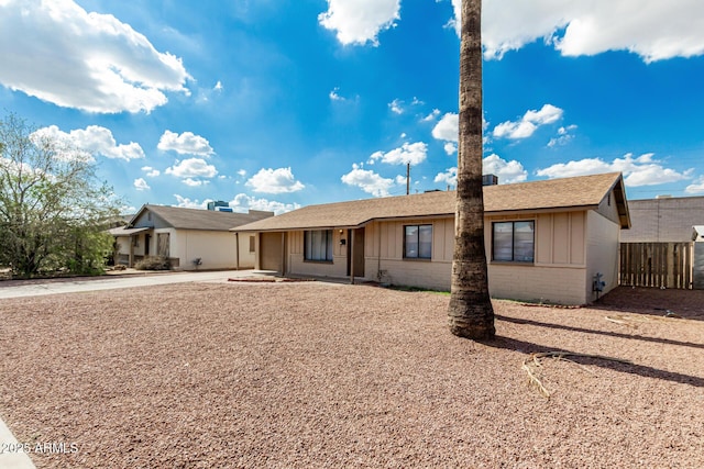 1512 W Crescent Ave, Mesa, AZ 85202 - single story home with concrete driveway, brick siding, a shingled roof, and board and batten siding