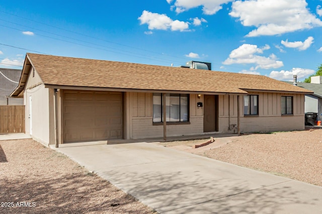 1512 W Crescent Ave, Mesa, AZ 85202 - ranch-style house featuring an attached garage, concrete driveway, brick siding, a shingled roof, and board and batten siding