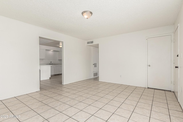 1512 W Crescent Ave, Mesa, AZ 85202 - unfurnished room with a textured ceiling and a sink
