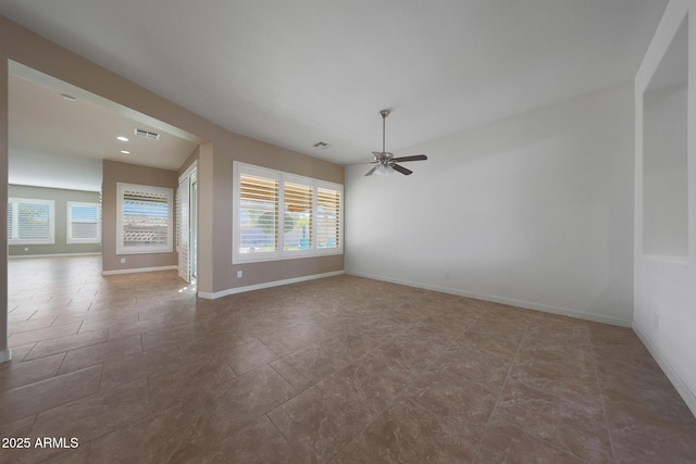 unfurnished room featuring ceiling fan