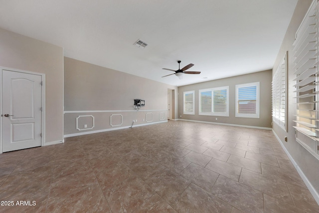 unfurnished room featuring ceiling fan