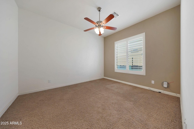 carpeted empty room featuring ceiling fan