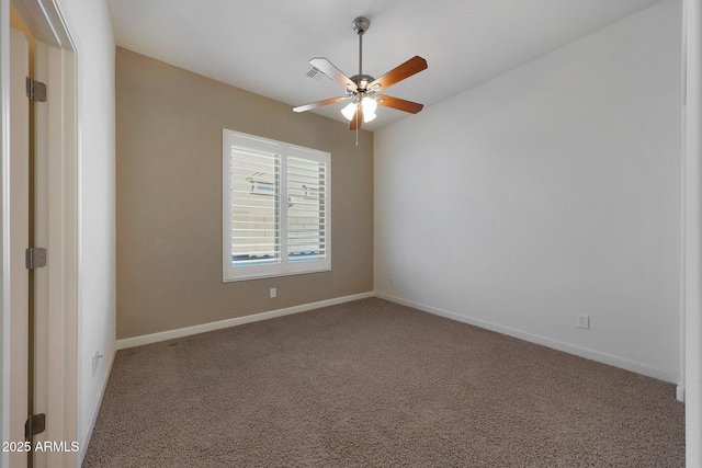 carpeted spare room featuring ceiling fan