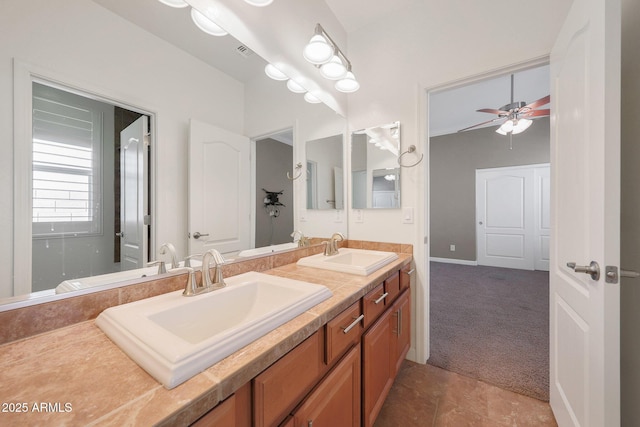 bathroom featuring ceiling fan, vanity, and tile patterned floors