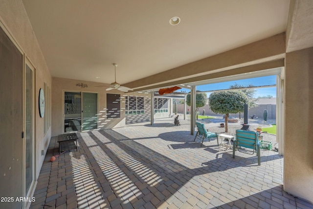 view of patio / terrace featuring ceiling fan