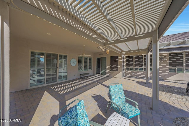 view of patio / terrace with a pergola and ceiling fan