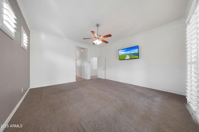 spare room with ceiling fan, ornamental molding, and carpet flooring