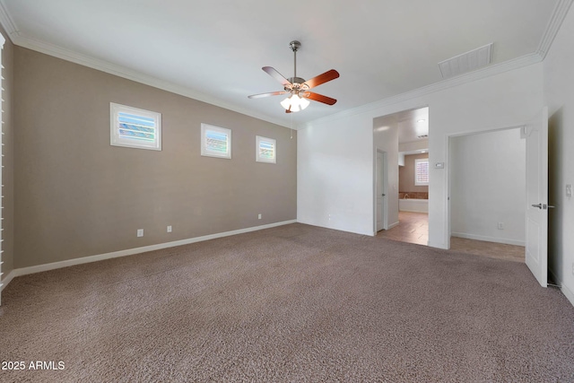 carpeted spare room featuring ceiling fan and ornamental molding