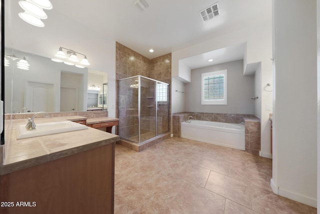 bathroom featuring vanity, tile patterned floors, and plus walk in shower