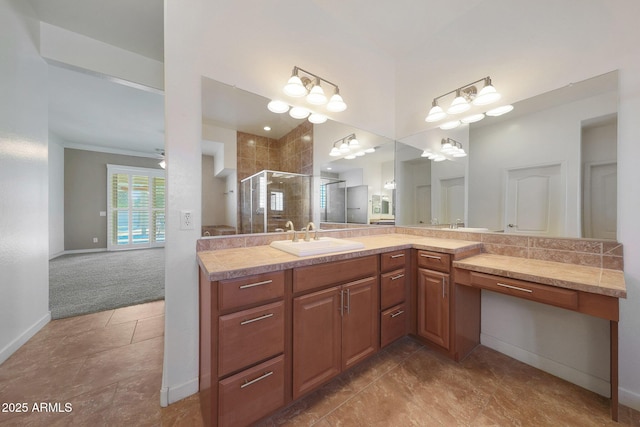 bathroom featuring tile patterned flooring, vanity, ceiling fan, and a shower with shower door