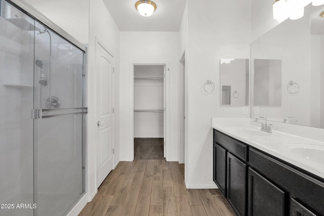 bathroom with vanity and an enclosed shower