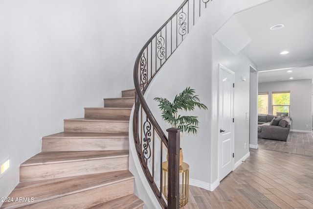 staircase with light wood-type flooring