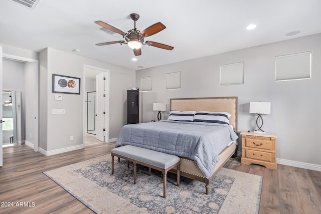 bedroom with ceiling fan and dark wood-type flooring