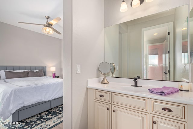 bedroom with ceiling fan and sink