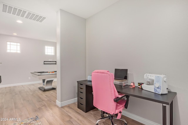 office with light wood-type flooring