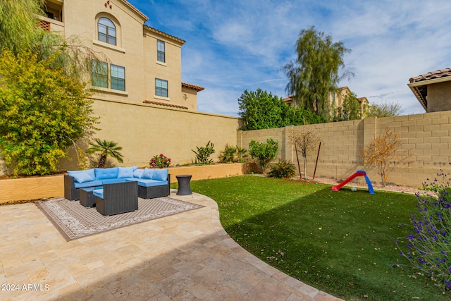 view of yard with outdoor lounge area and a patio