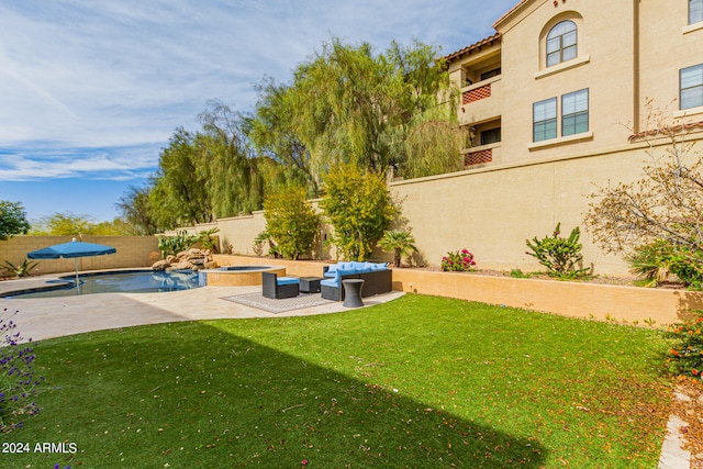 view of yard with a balcony, a patio area, an outdoor living space, and a fenced in pool