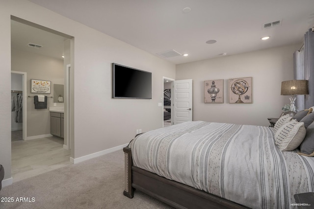 carpeted bedroom featuring connected bathroom