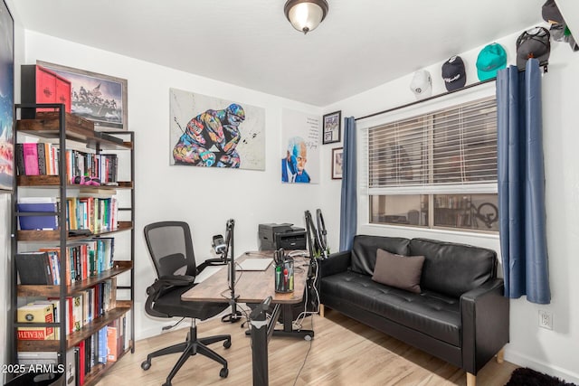 office space with light hardwood / wood-style floors