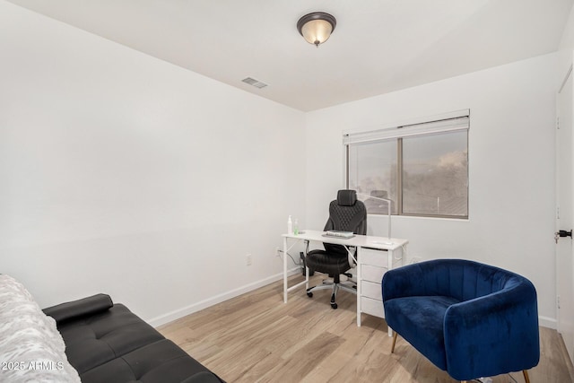 office space with light hardwood / wood-style flooring