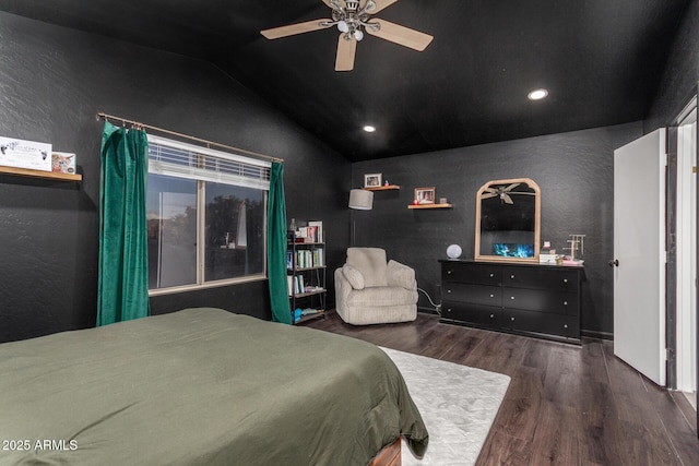 bedroom with lofted ceiling, dark wood-type flooring, and ceiling fan