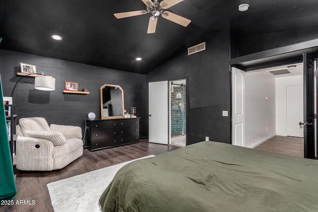 bedroom with dark wood-type flooring, ceiling fan, and vaulted ceiling