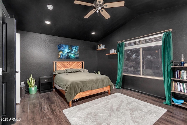 bedroom featuring dark wood-type flooring, ceiling fan, and vaulted ceiling