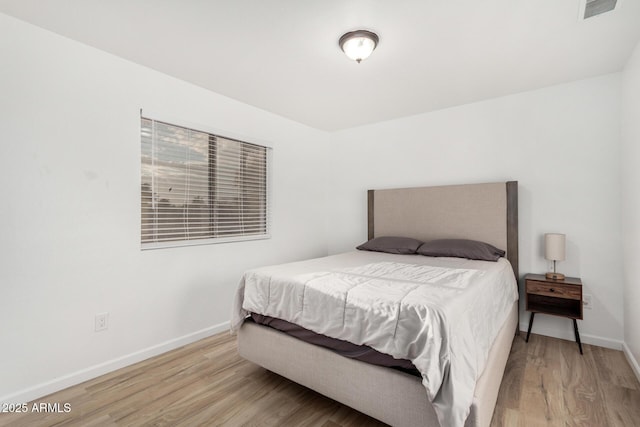 bedroom featuring light hardwood / wood-style flooring