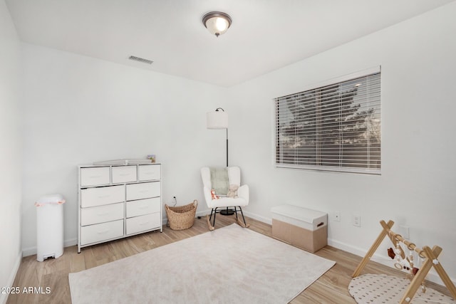 living area featuring hardwood / wood-style floors